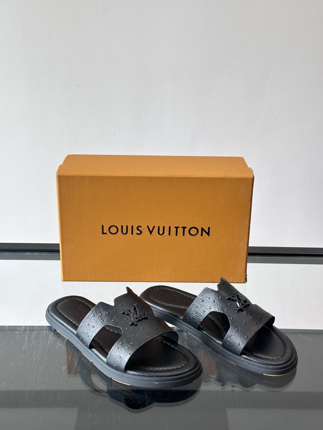 Louis Vuitton Black Embossed Slide Sandals — front