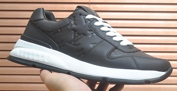 Louis Vuitton Black Embossed Low-Top Sneakers — hero