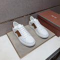 White and Brown Low-Top Sneakers — hero
