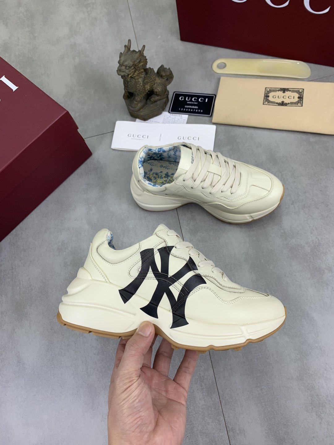 Gucci Cream Chunky Sneakers with Black Accents — model