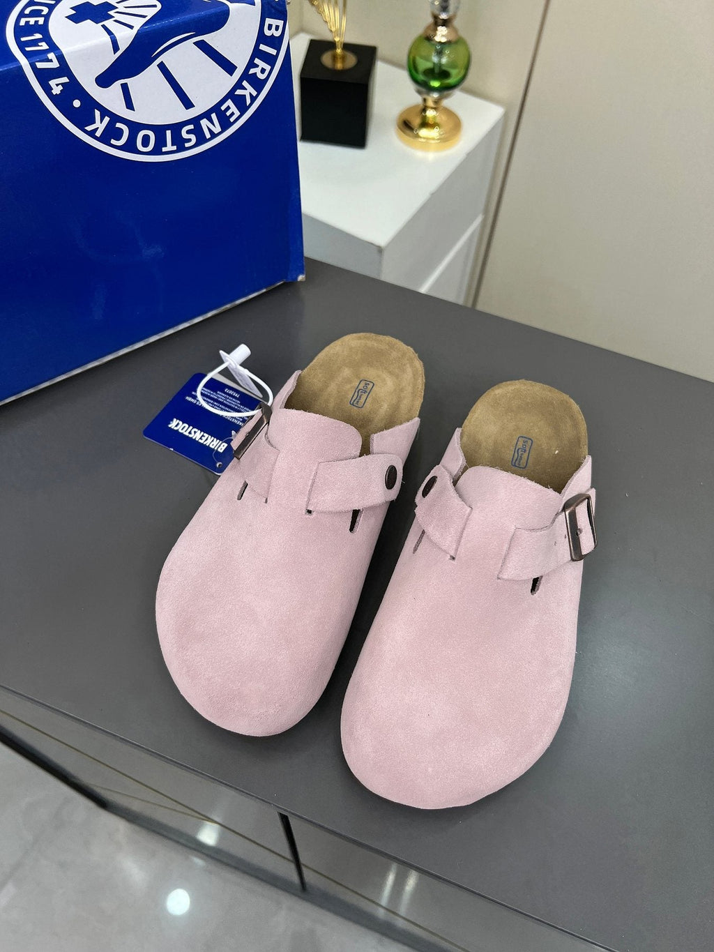 Birkenstock Light Pink Buckle Clogs — front