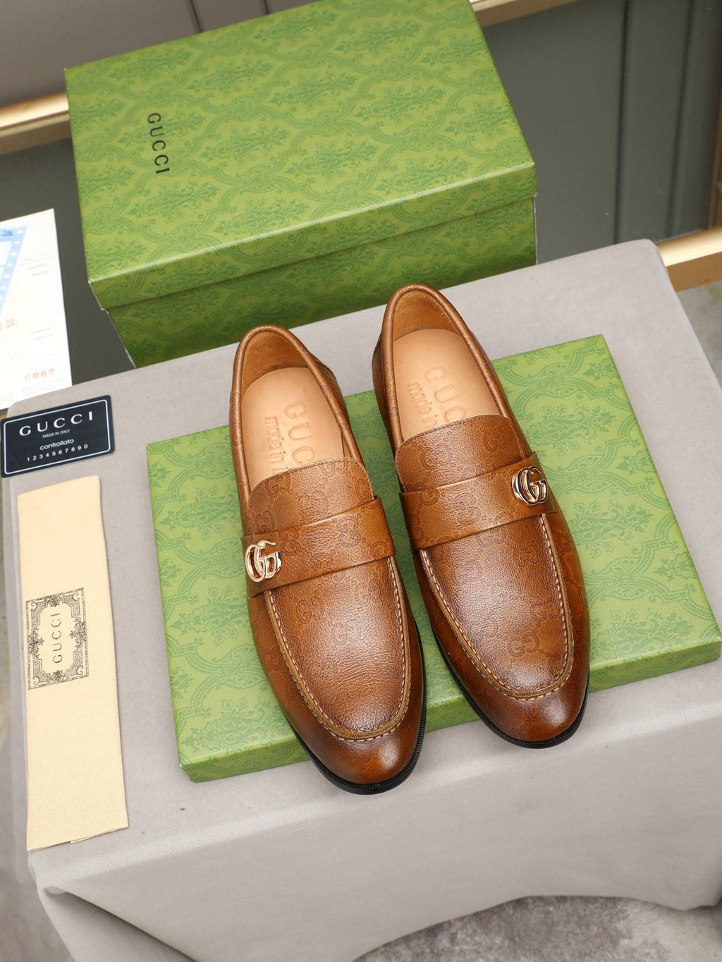 Gucci Brown Monogram Hardware Loafers — front