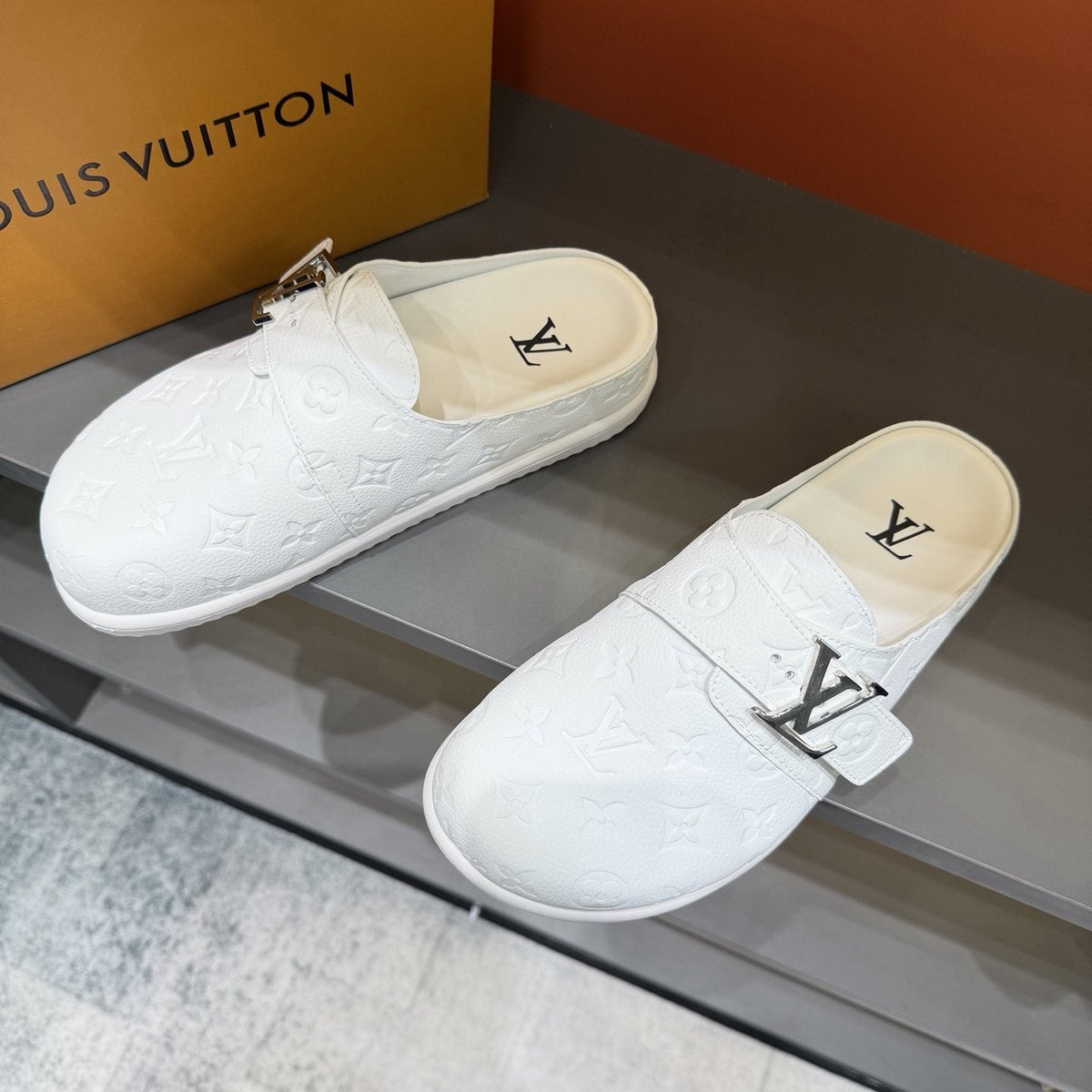 Louis Vuitton White Embossed Slide Sandals — front