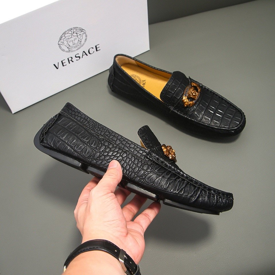 Men's Black Textured Loafers with Gold-Tone Ornament — model