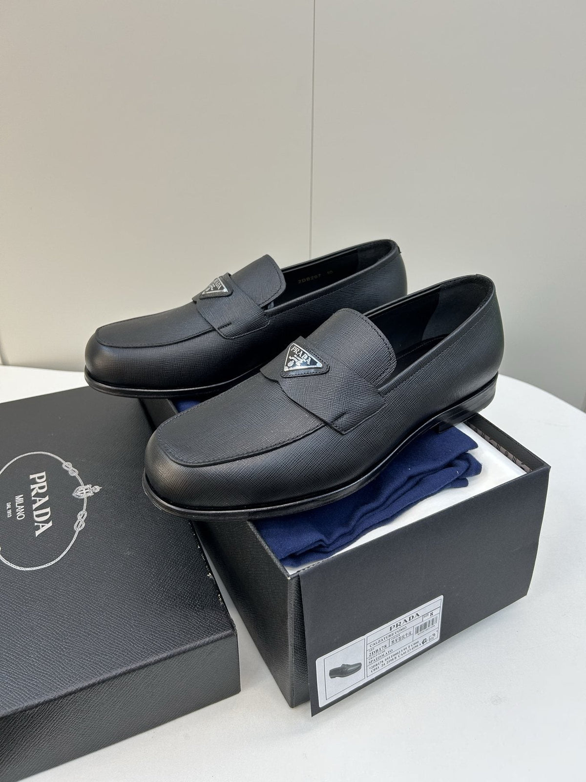 Prada Black Triangular Plaque Loafers — front
