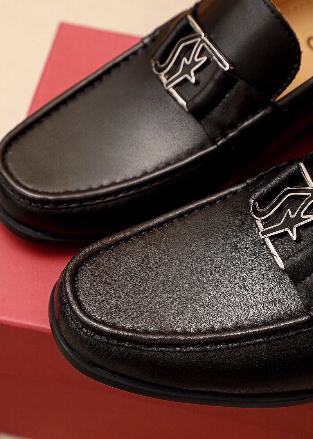 Ferragamo Black Metal Hardware Loafers — detail