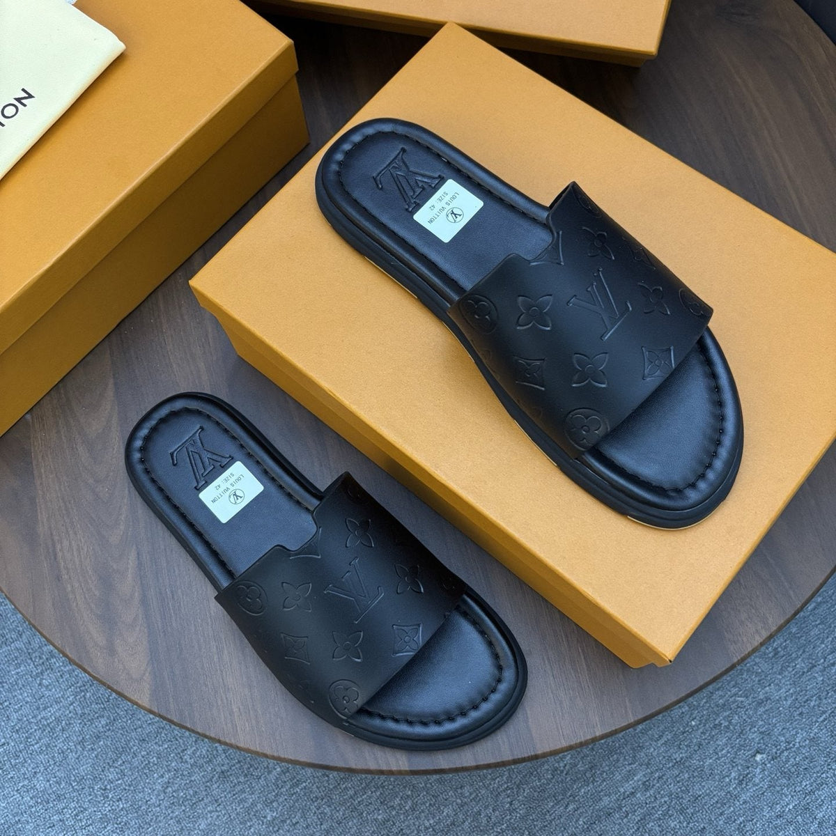 Louis Vuitton Black Embossed Slide Sandals — front