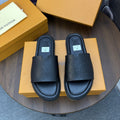 Louis Vuitton Black Embossed Slide Sandals — hero