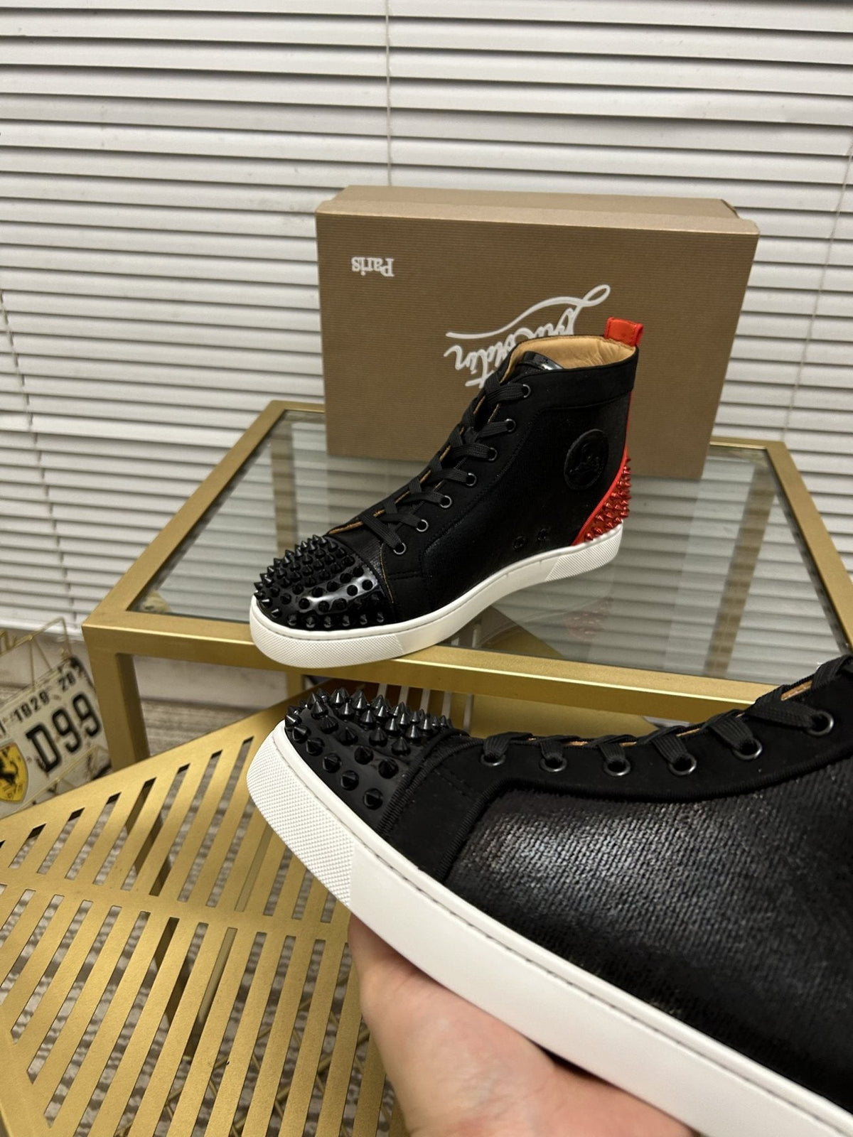 Christian Louboutin Perforated Toe High-Top Sneakers — detail