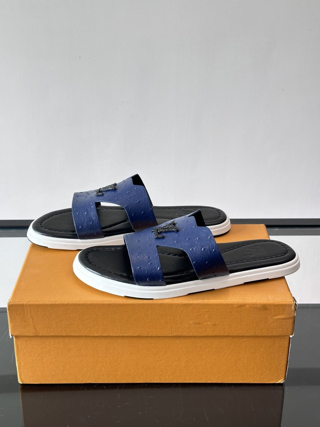 Louis Vuitton Embossed Blue Slide Sandals — side