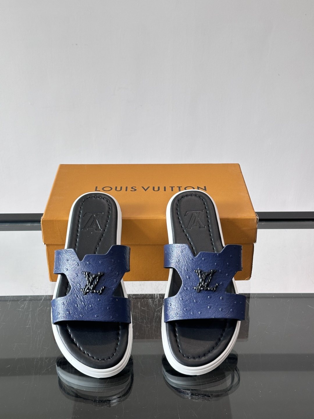 Louis Vuitton Embossed Blue Slide Sandals — hero
