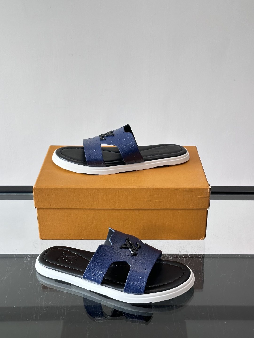 Louis Vuitton Embossed Blue Slide Sandals — side