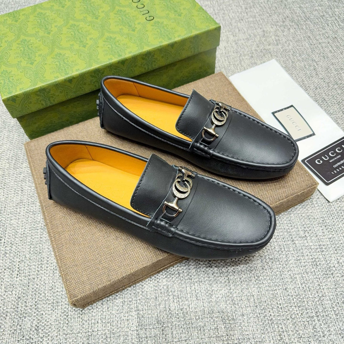 GUCCI Black Metal-Detail Loafers — hero