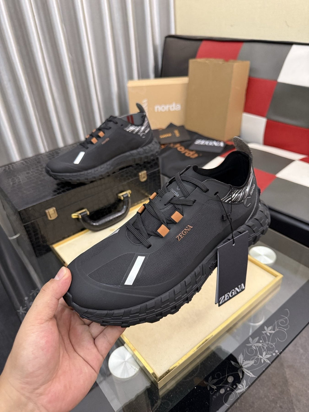 ZEGNA Black Trail Running Shoes with Orange Accents — model