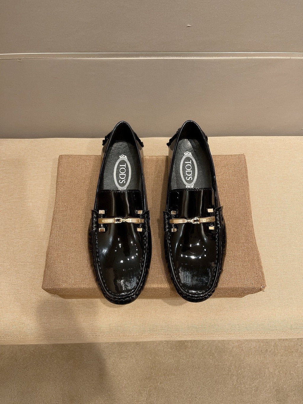Tod's Glossy Metal Bar Loafers — hero