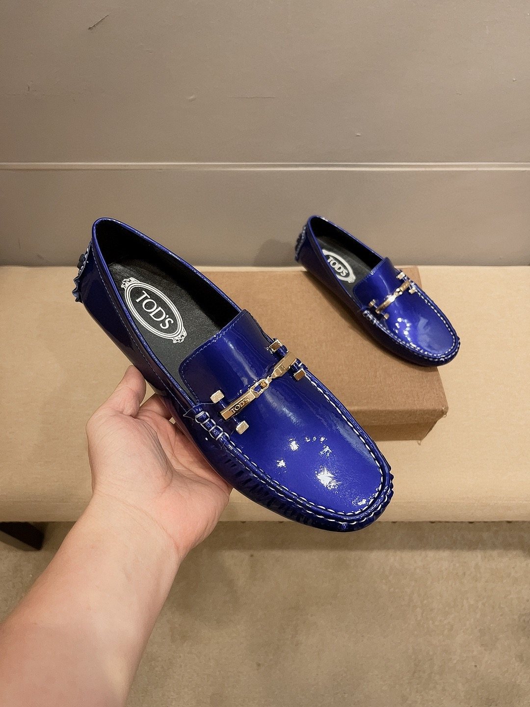 Tod's Glossy Metal Bar Loafers — model