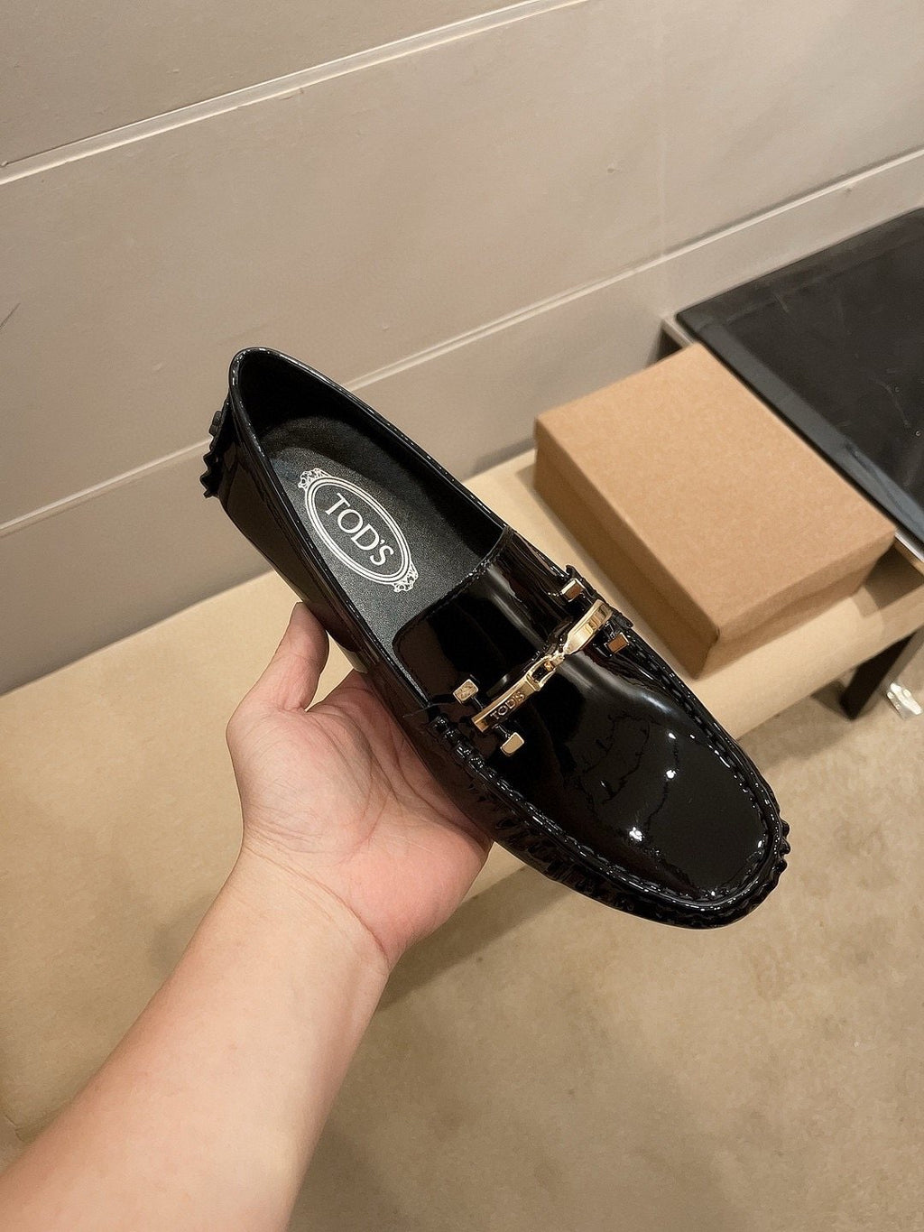 Tod's Glossy Metal Bar Loafers — model