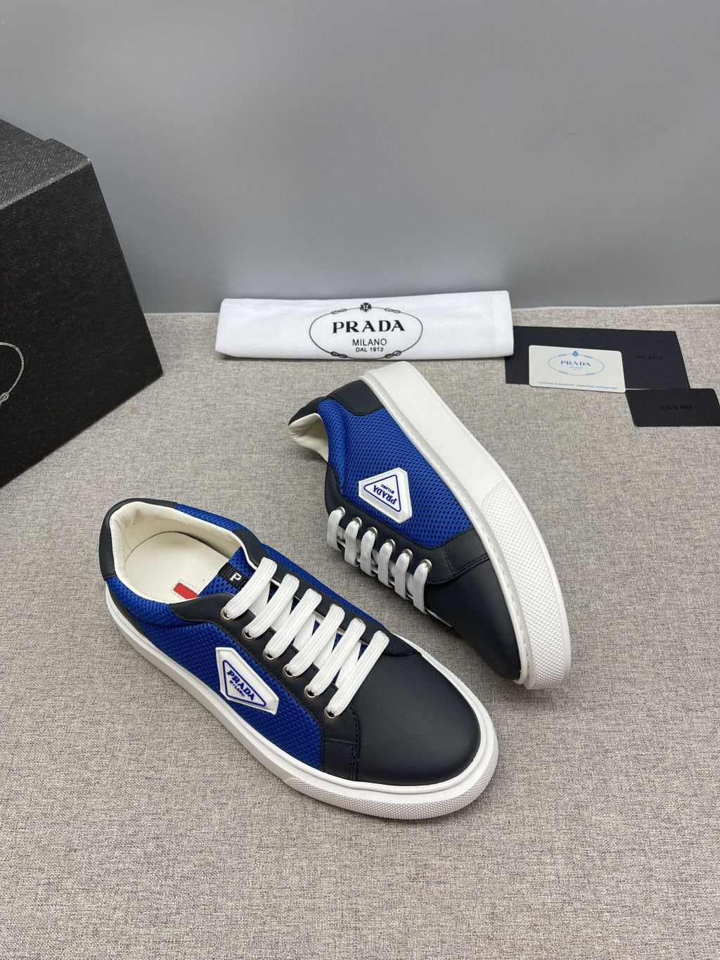 Prada Triangle Patch Low-Top Sneakers — front