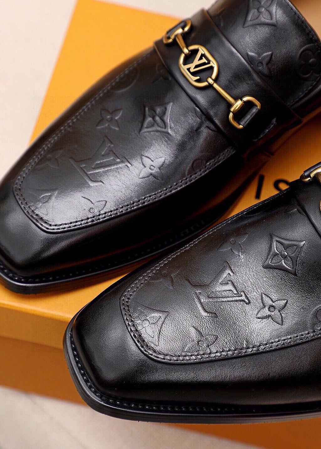 Louis Vuitton Embossed Buckle Loafers — detail