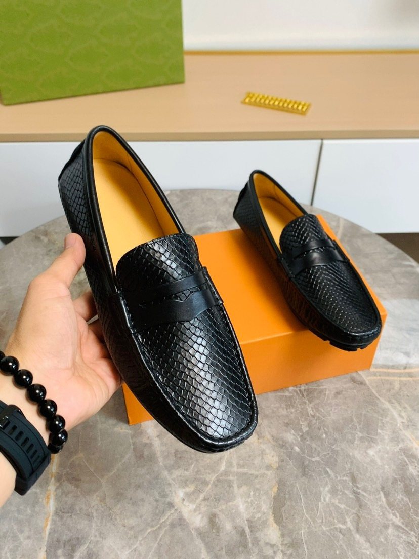 Louis Vuitton Textured Penny Loafers — model