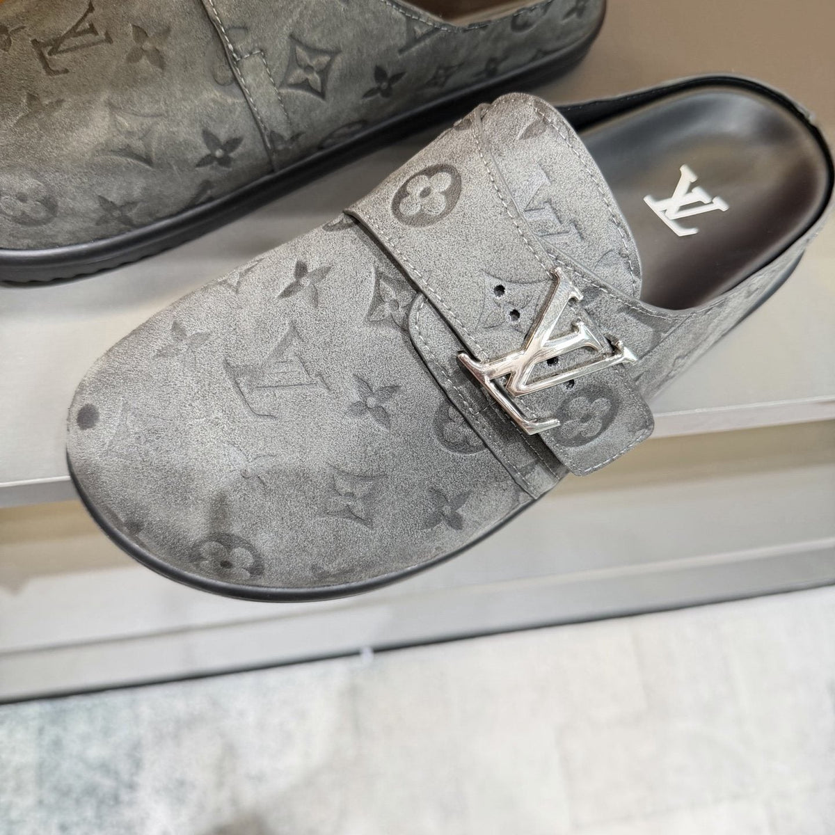 Louis Vuitton Embossed Buckle Slide Sandals — detail