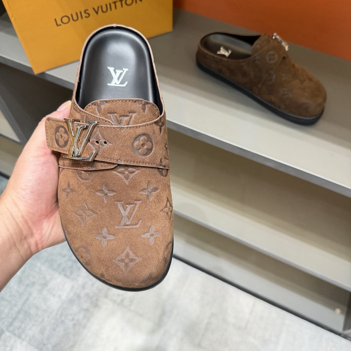 Louis Vuitton Embossed Buckle Slide Sandals — model