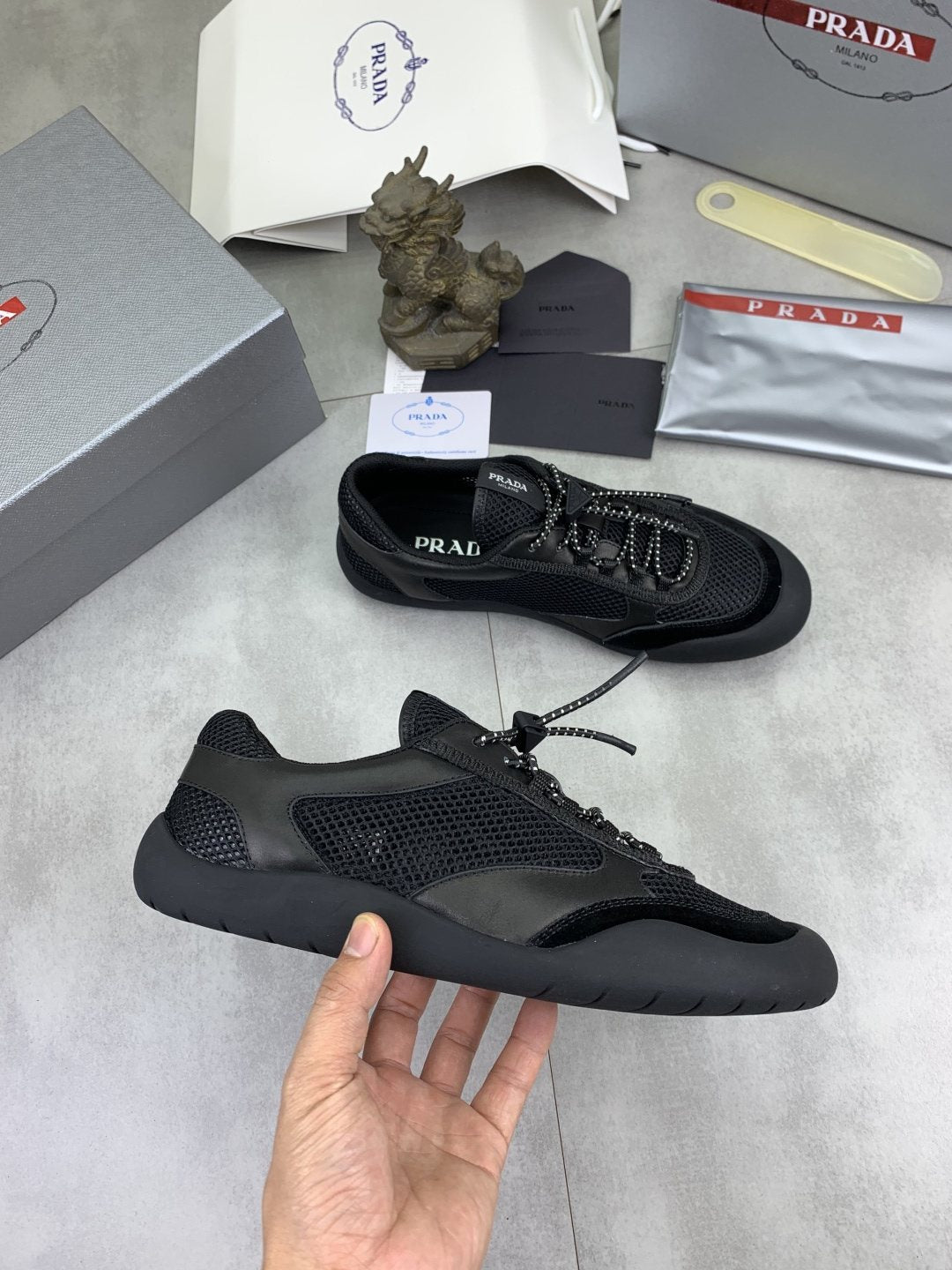 Prada Paneled Low-Top Sneakers — model