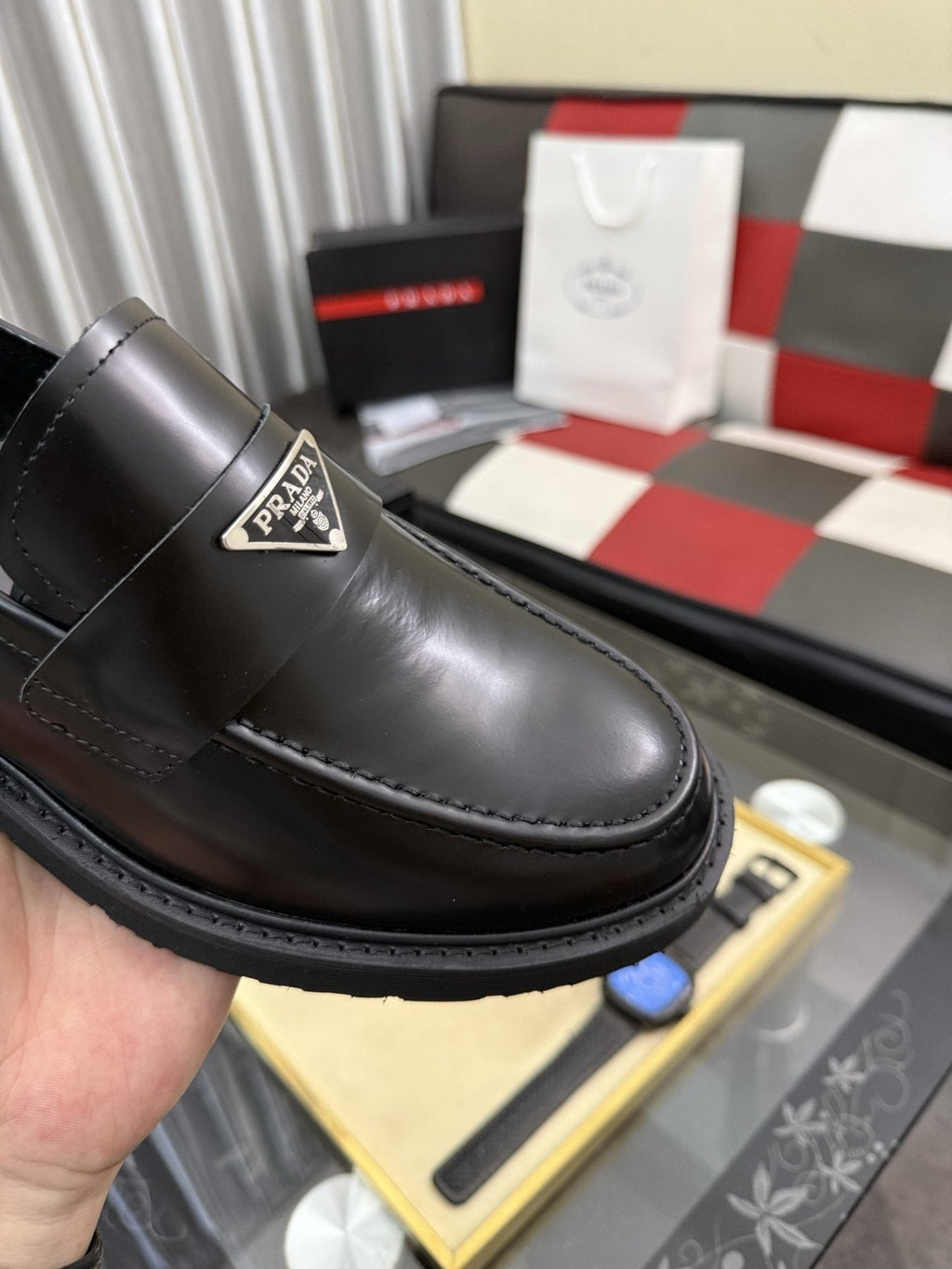 Prada Triangle Plaque Loafers — detail