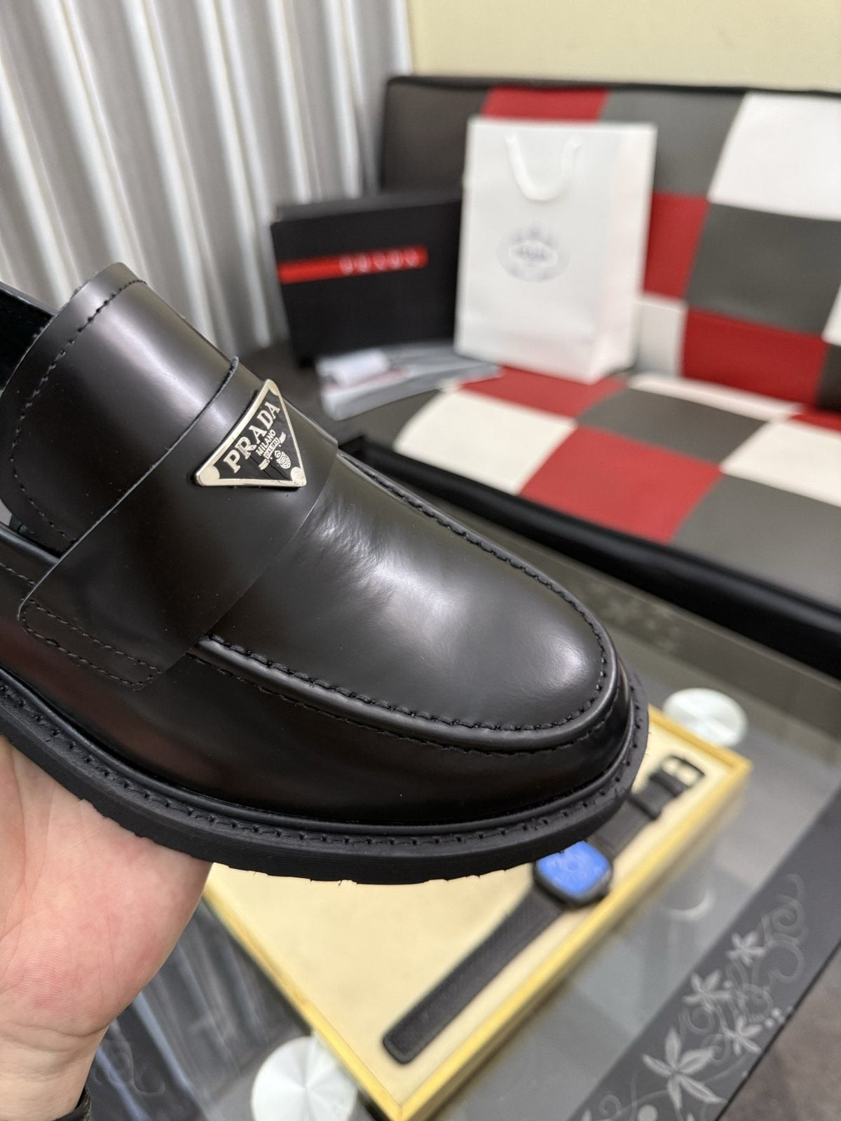 Prada Triangle Plaque Loafers — detail
