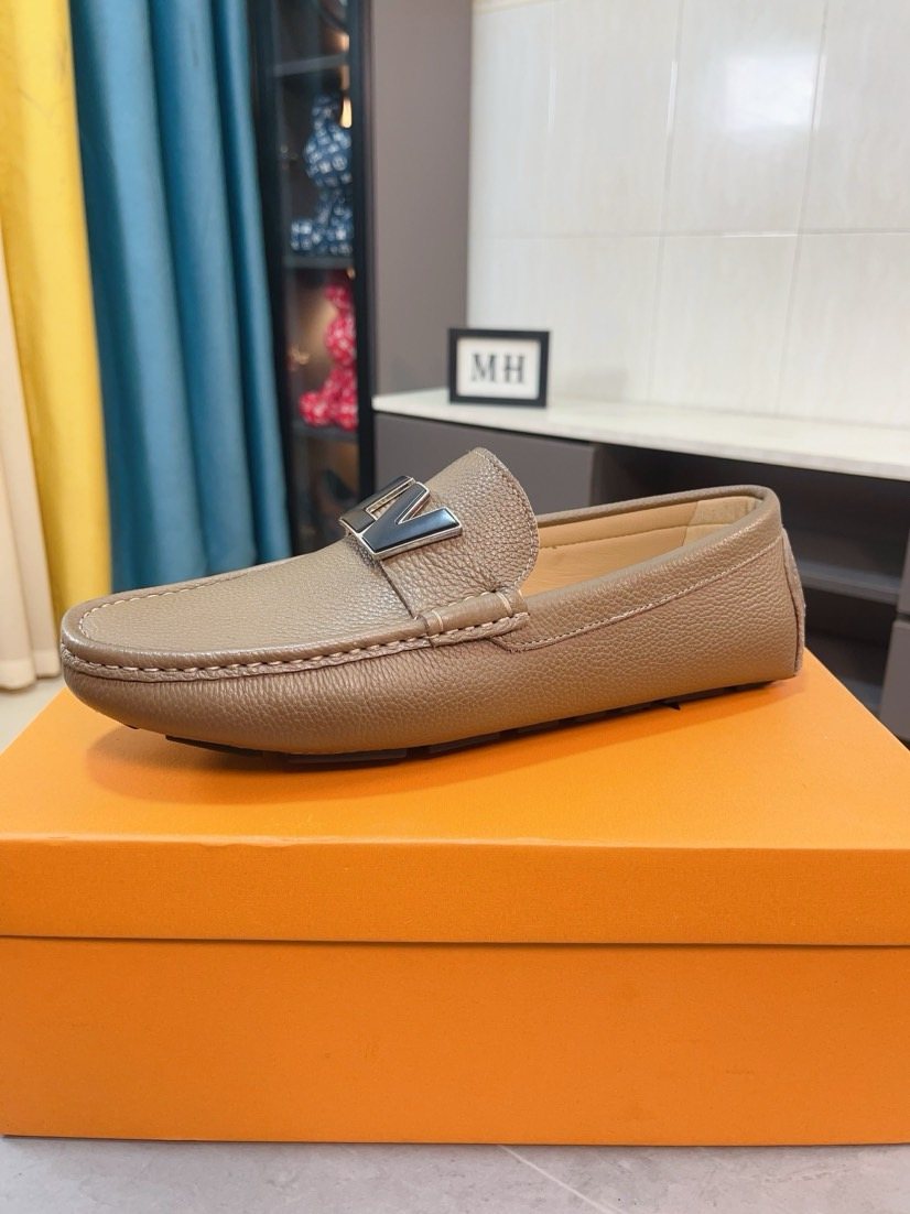 Louis Vuitton Pebbled Metal-Accent Driving Loafers — model