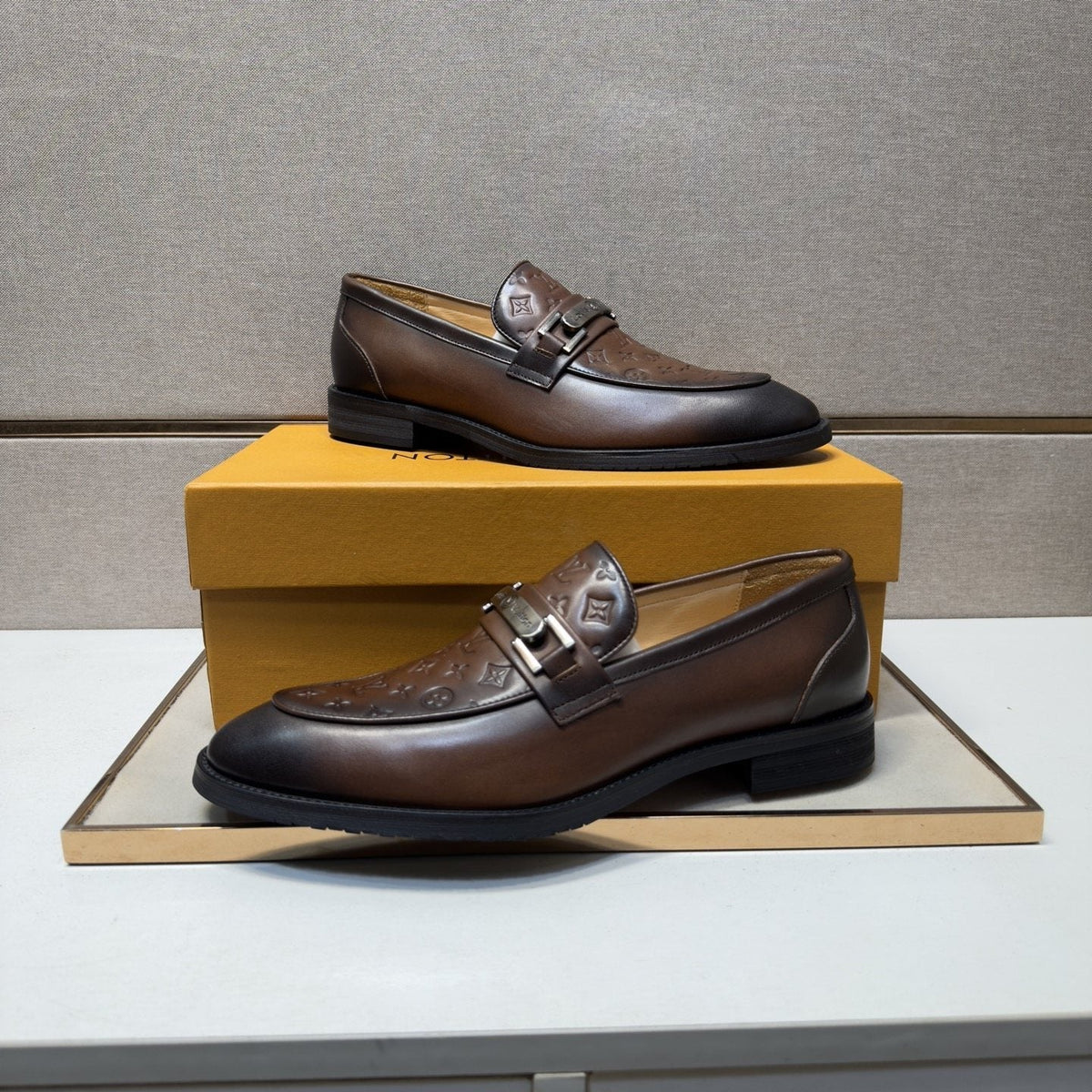 Louis Vuitton Embossed Metal-Bar Loafers — front