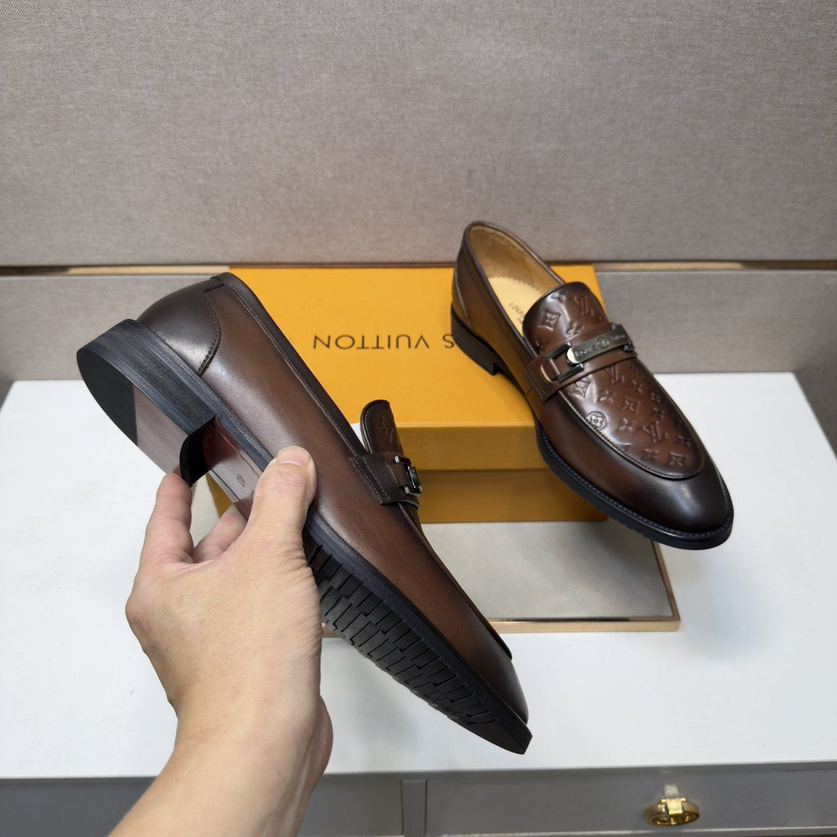 Louis Vuitton Embossed Metal-Bar Loafers — model