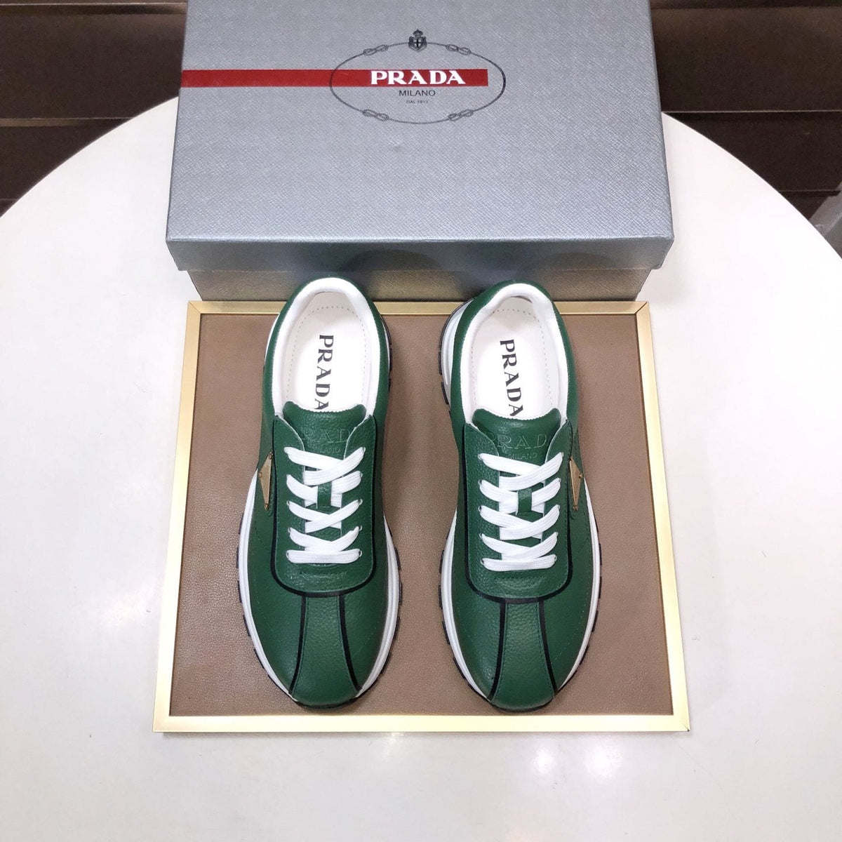 Prada Triangle Plaque Low-Top Sneakers — front
