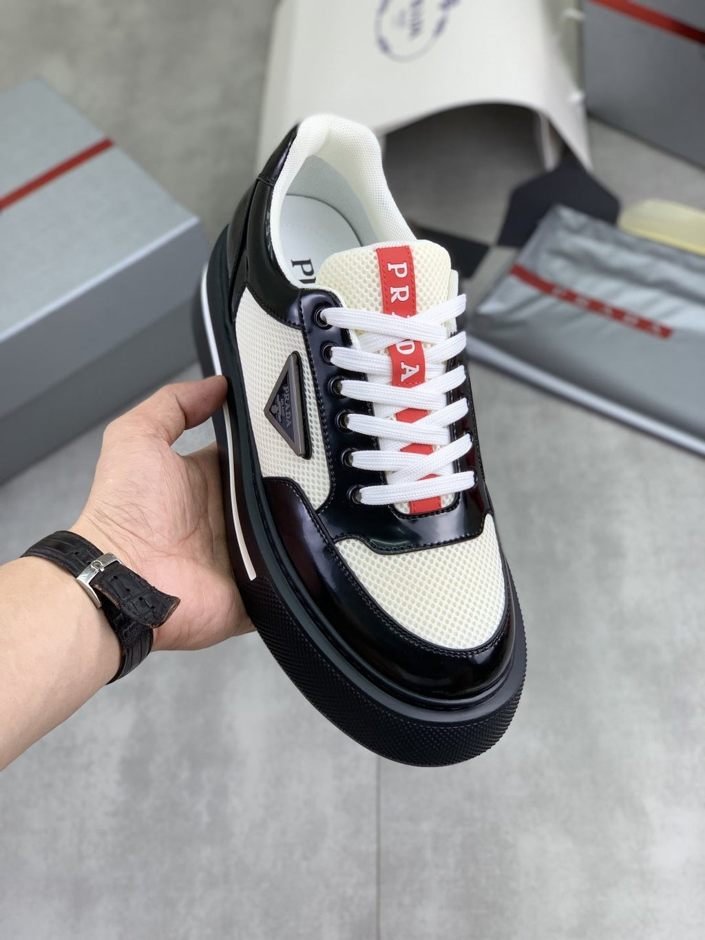Prada Triangle Patch Low-Top Sneakers — front