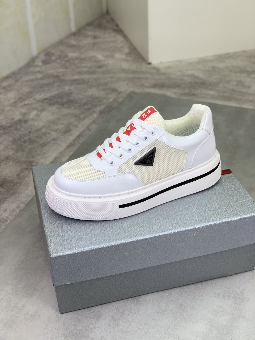Prada Triangle Patch Low-Top Sneakers — side