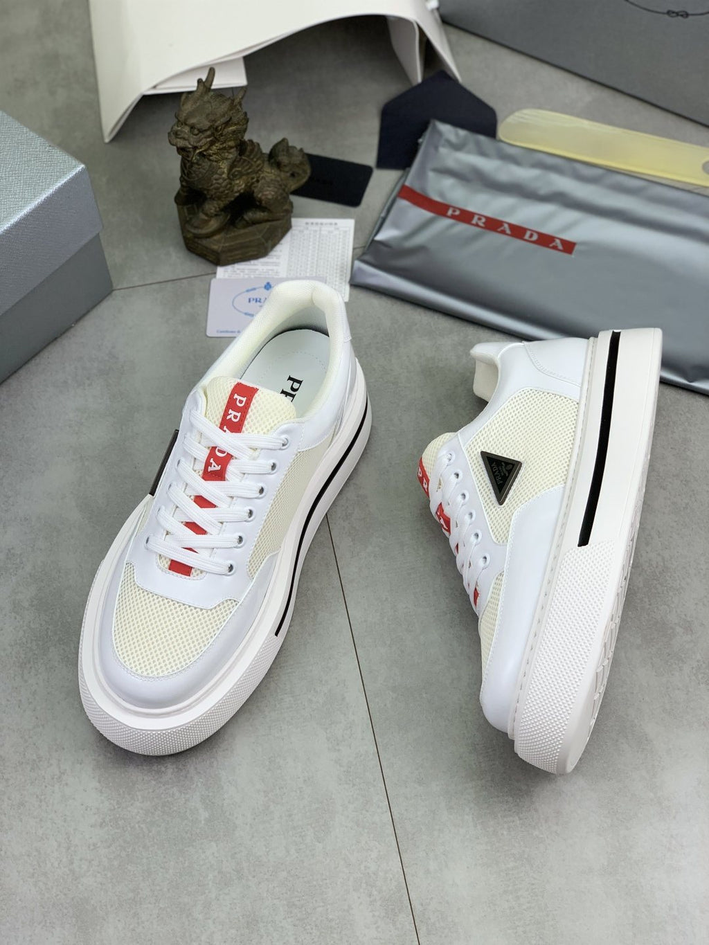 Prada Triangle Patch Low-Top Sneakers — side