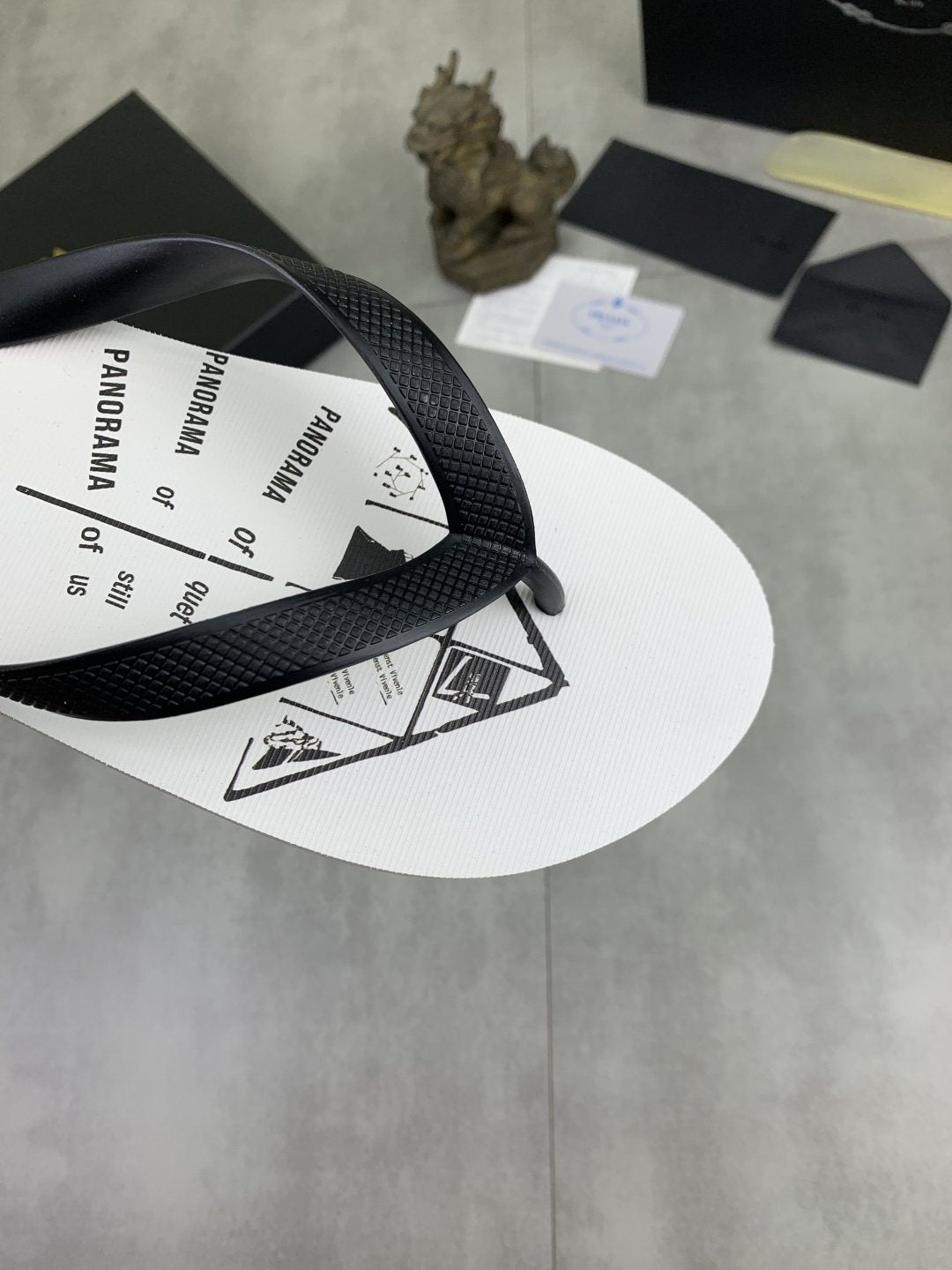 Prada Black Strap White Flip Flops — detail