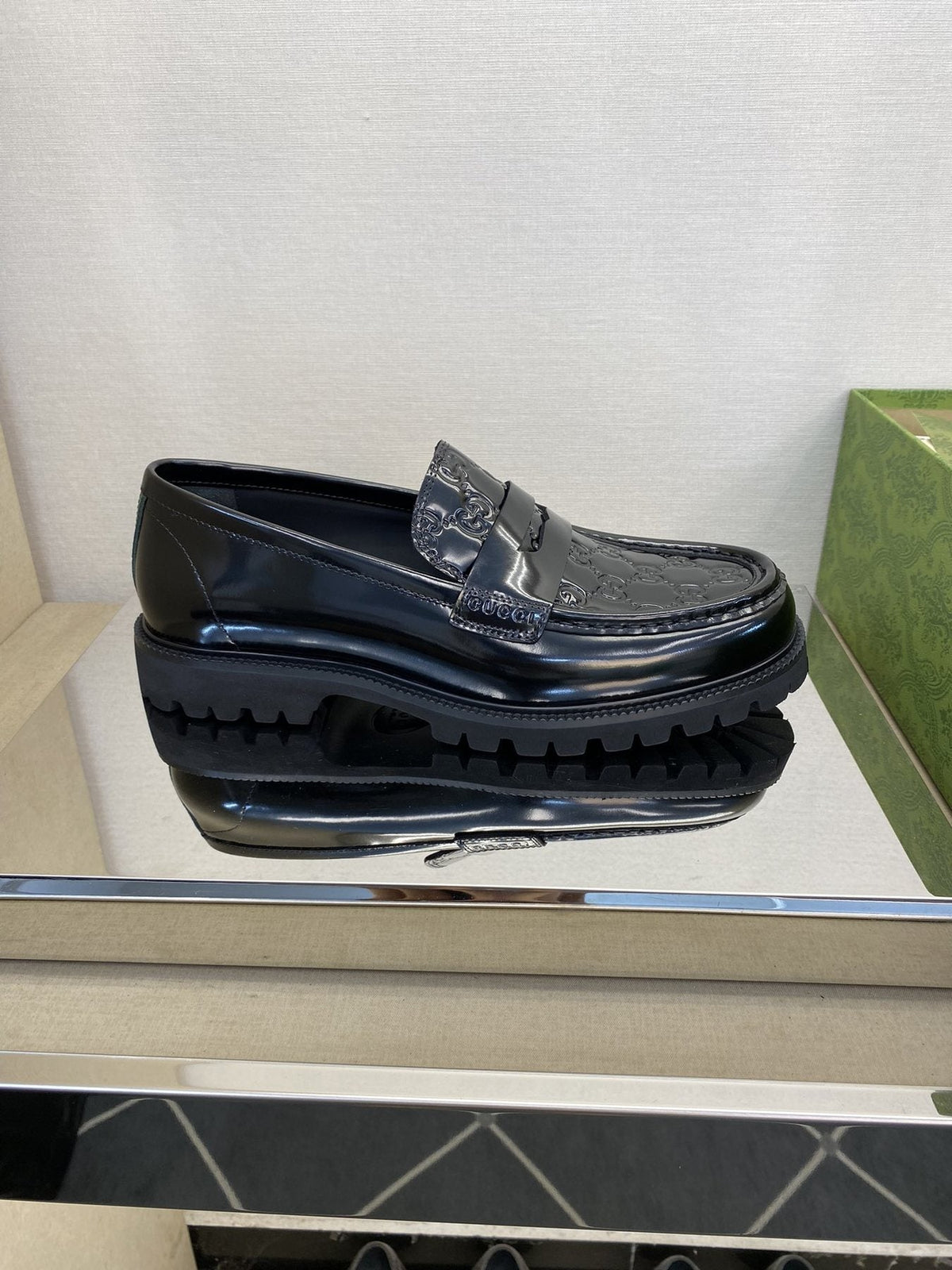 Gucci Black Embossed Lug Sole Loafers — side