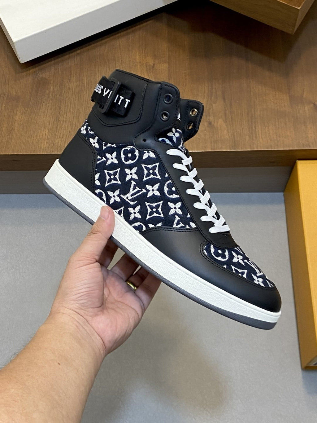 Louis Vuitton Rivoli Patterned High-Top Sneakers — model