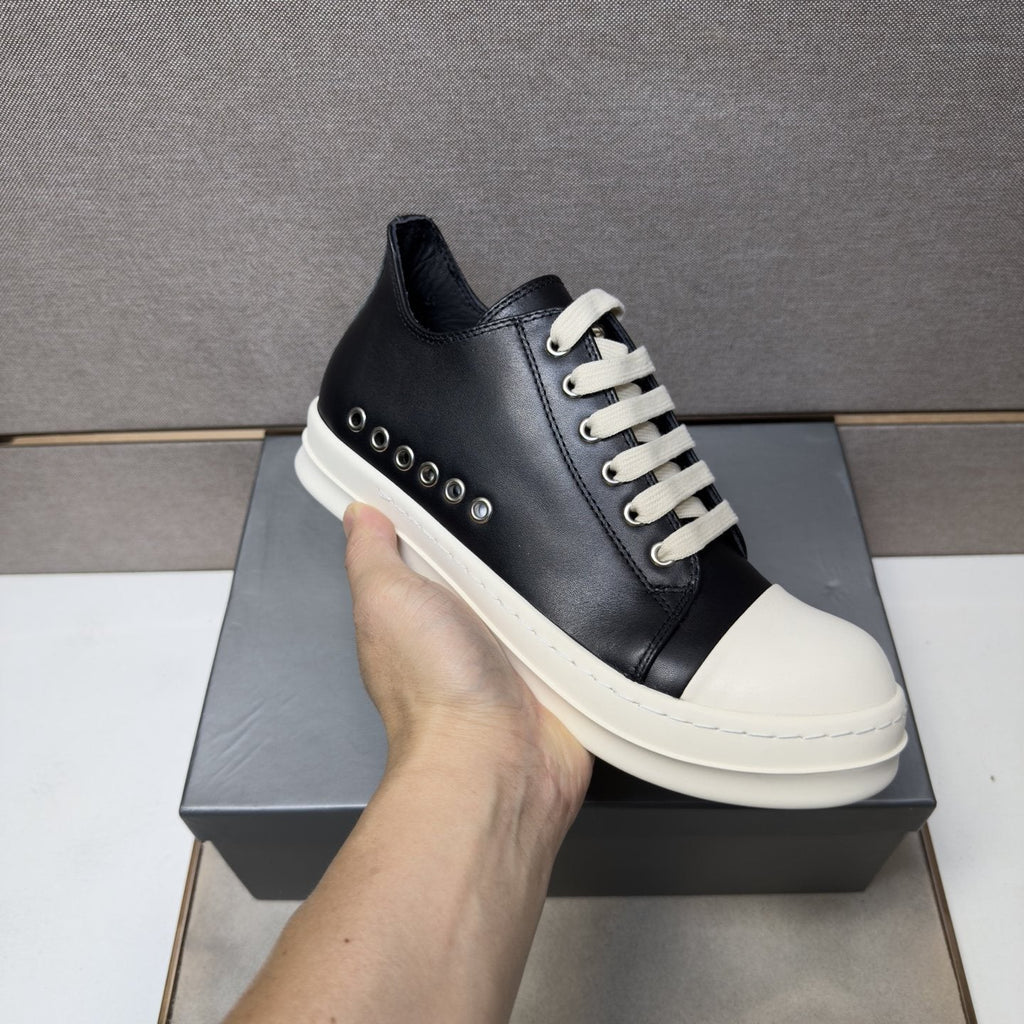 Black and Off-White Low-Top Sneakers — model