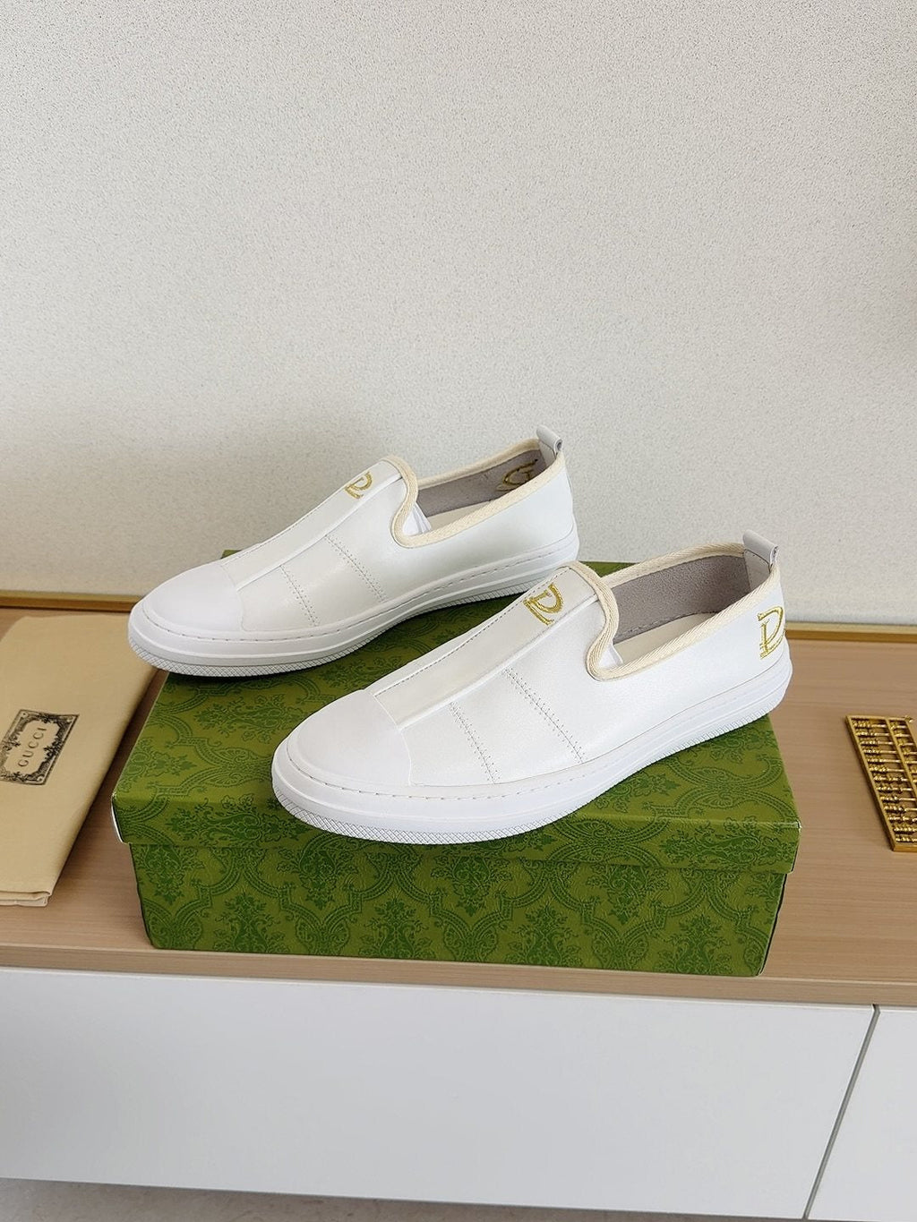 Gucci Brown Slip-On Sneakers with White Toe Caps — front