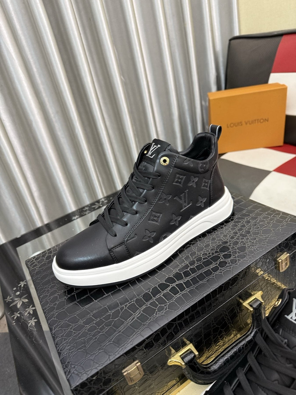 Louis Vuitton Embossed High-Top Sneakers — front