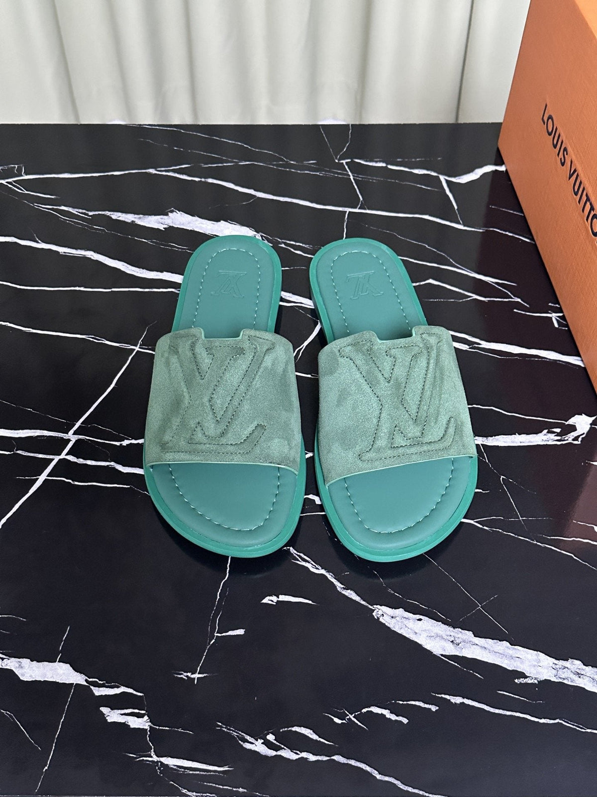 Louis Vuitton Embossed Strap Slide Sandals — hero