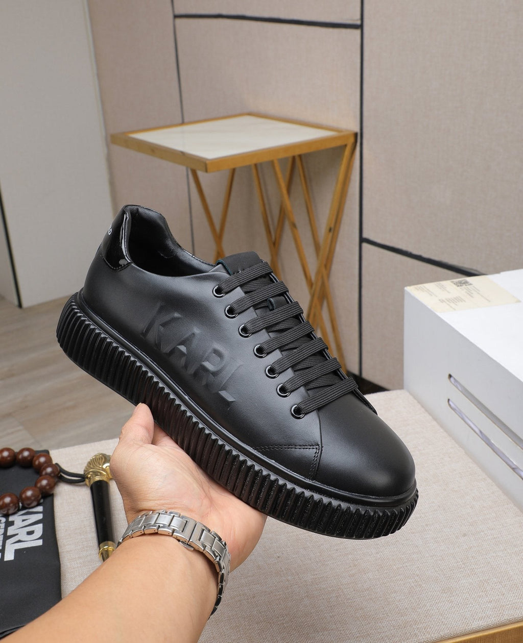 Karl Lagerfeld Embossed Logo Low-Top Sneakers — model