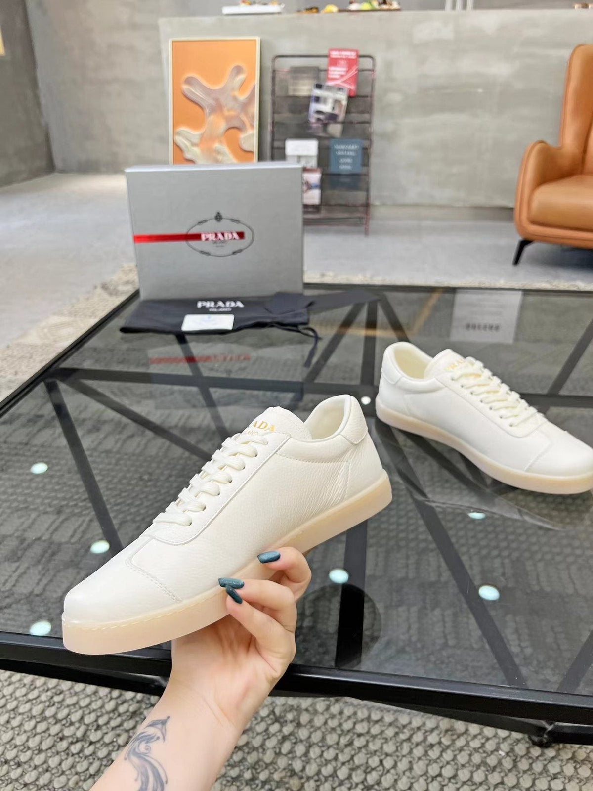 Prada Gold Accent Low-Top Sneakers — side