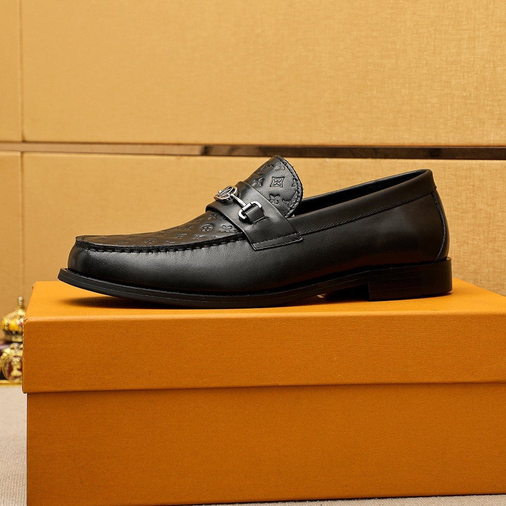 Louis Vuitton Embossed Buckle Loafers — hero
