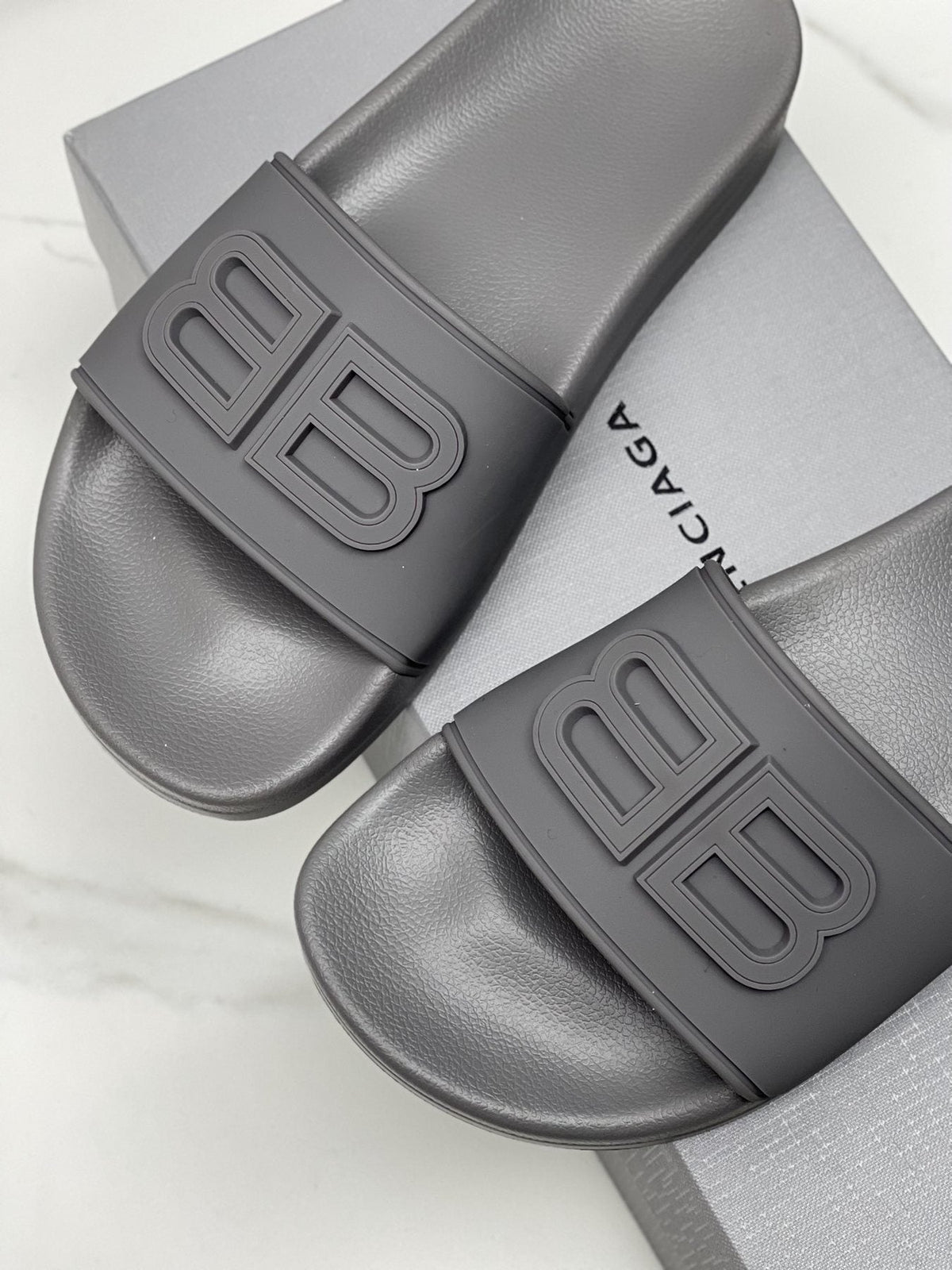 Balenciaga Raised Motif Slide Sandals — side