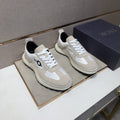 Dior Men's Paneled Low-Top Sneakers — hero