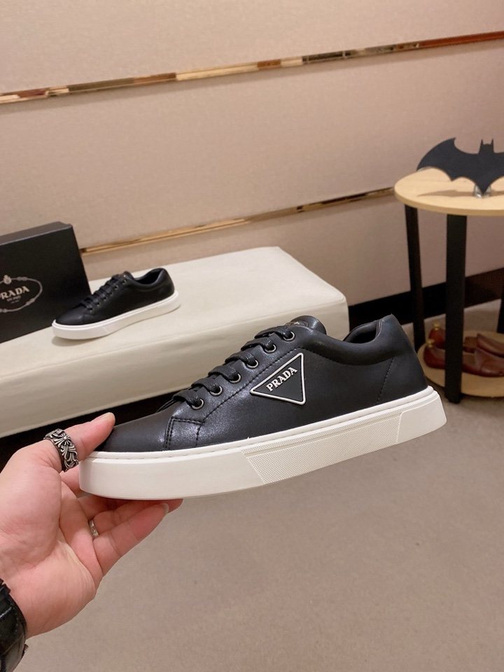 Prada Plaque Low-Top Sneakers — model